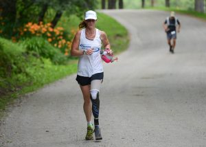 VT100 - AWD Athlete racing with a prosthetic left leg