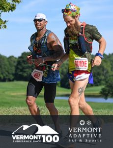 Vermont 100 and Vermont Adaptive promotional photo, with a runner/guide and visually impaired athlete running together on the Vermont 100 course. 