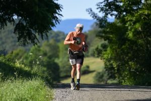 John cresting a hill at the VT100, 2025